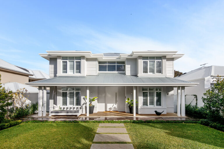 Custom-built two-storey residential home by Distinctive Homes WA in Cottesloe with a modern facade and front veranda